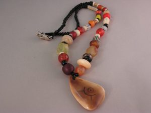 Orange and Gooseberry Trade-beads with Scrimshaw Walrus Tusk Artifact by Janet Walker